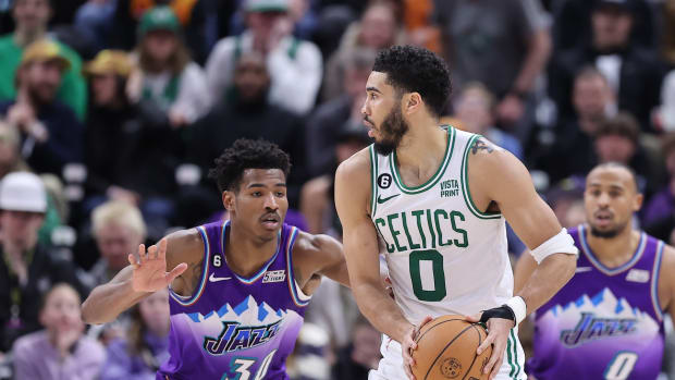 Boston Celtics forward Jayson Tatum (0) posts up against Utah Jazz guard Ochai Agbaji (30) in the fourth quarter at Vivint Arena.